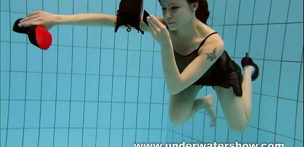  Brunette Kristy stripping underwater